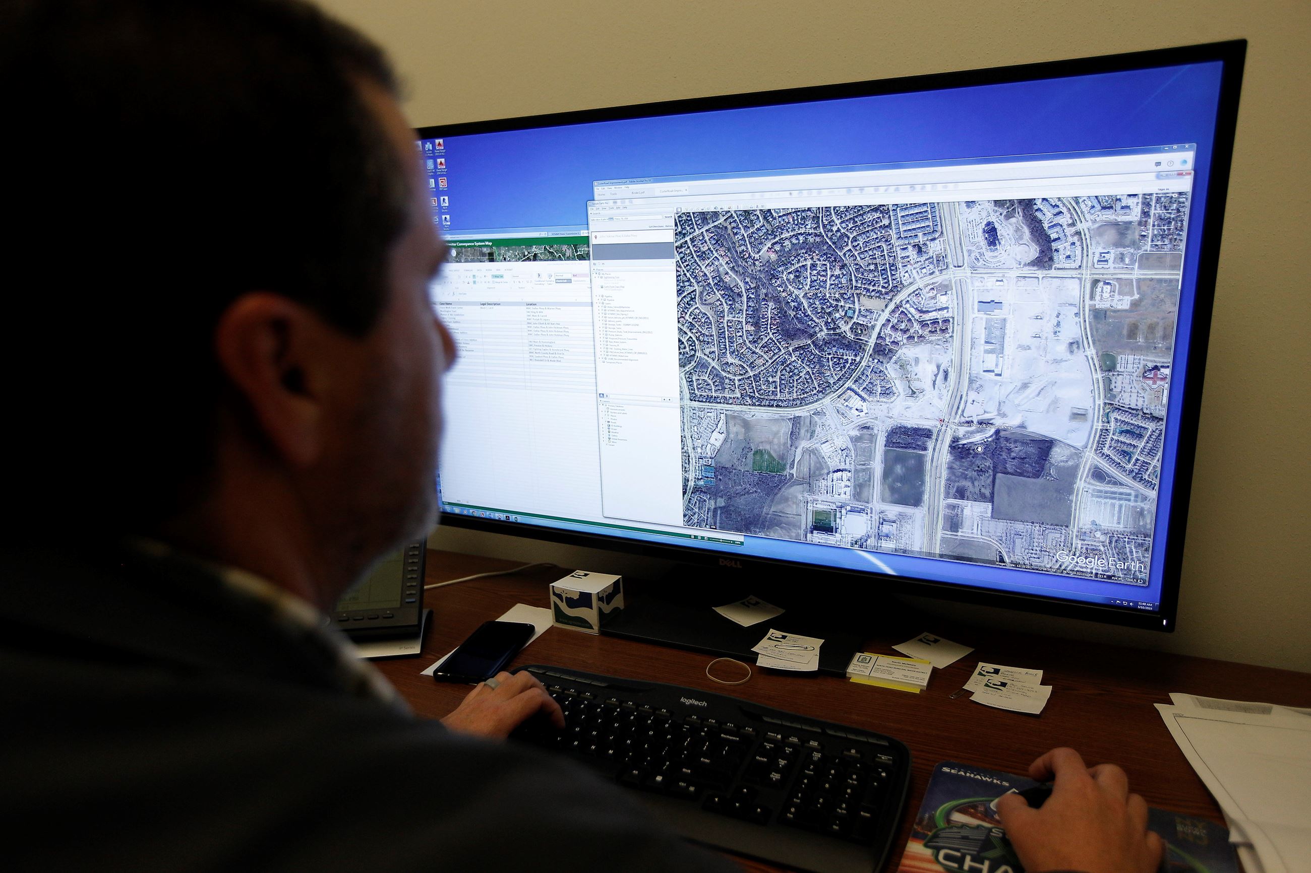 image of man looking at computer screen
